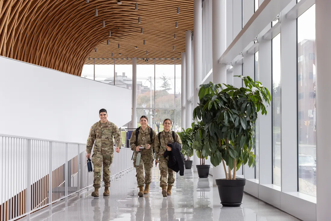 Three people walking together.